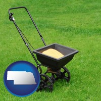 nebraska map icon and a lawn fertilizer spreader