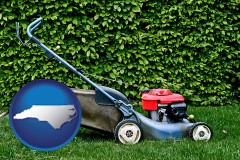 north-carolina map icon and a power lawn mower
