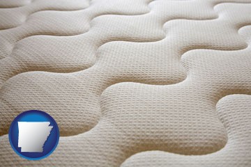 a mattress surface - with Arkansas icon