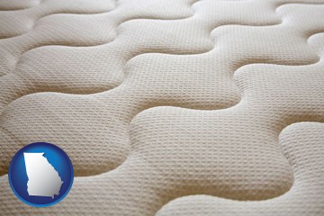 a mattress surface - with Georgia icon