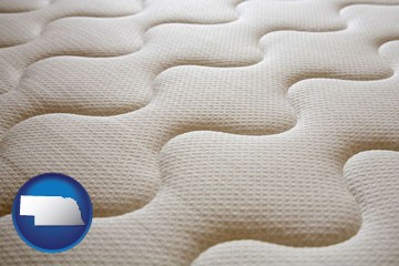 a mattress surface - with Nebraska icon
