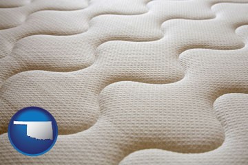 a mattress surface - with Oklahoma icon