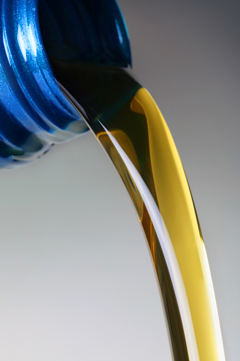 motor oil being poured from a container (large image)