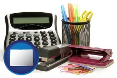 colorado map icon and office supplies: calculator, paper clips, pens, scissors, stapler, and staples