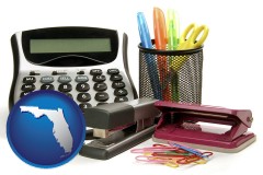 florida map icon and office supplies: calculator, paper clips, pens, scissors, stapler, and staples