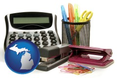 michigan map icon and office supplies: calculator, paper clips, pens, scissors, stapler, and staples