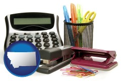 montana map icon and office supplies: calculator, paper clips, pens, scissors, stapler, and staples