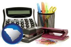 south-carolina map icon and office supplies: calculator, paper clips, pens, scissors, stapler, and staples