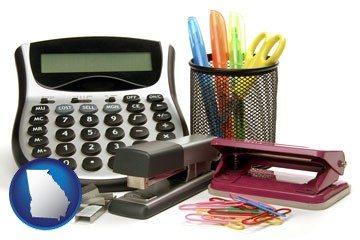 office supplies: calculator, paper clips, pens, scissors, stapler, and staples - with Georgia icon