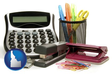 office supplies: calculator, paper clips, pens, scissors, stapler, and staples - with Idaho icon