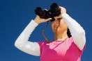 a woman looking through binoculars