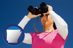 arkansas map icon and a woman looking through binoculars