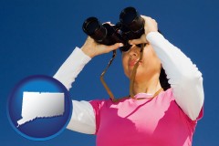 connecticut a woman looking through binoculars