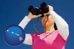 hawaii map icon and a woman looking through binoculars