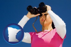 minnesota map icon and a woman looking through binoculars
