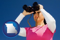 missouri a woman looking through binoculars