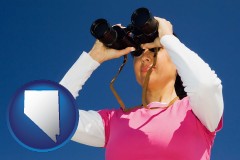 nevada a woman looking through binoculars
