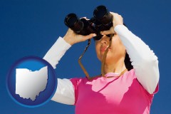 ohio a woman looking through binoculars
