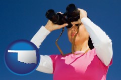 oklahoma a woman looking through binoculars