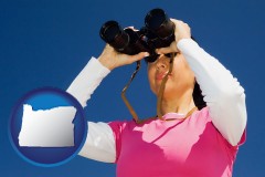 oregon a woman looking through binoculars