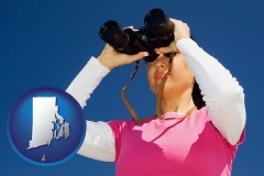 rhode-island a woman looking through binoculars