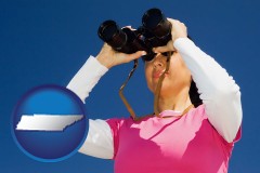 tennessee a woman looking through binoculars