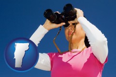 vermont a woman looking through binoculars