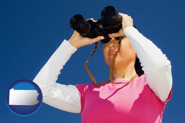 a woman looking through binoculars - with Pennsylvania icon