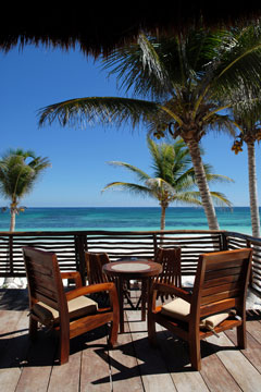 outdoor furniture on a tropical, oceanfront deck