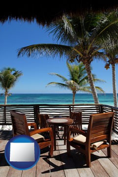 outdoor furniture on a tropical, oceanfront deck - with Wyoming icon