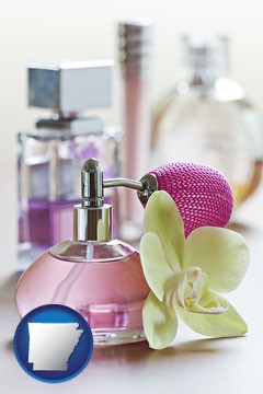 a perfume bottle, with atomizer, and an orchid flower - with Arkansas icon
