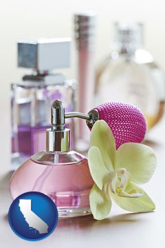 a perfume bottle, with atomizer, and an orchid flower - with California icon