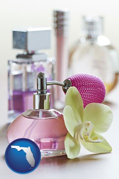 a perfume bottle, with atomizer, and an orchid flower - with Florida icon