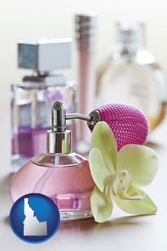 a perfume bottle, with atomizer, and an orchid flower - with Idaho icon