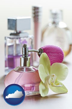 a perfume bottle, with atomizer, and an orchid flower - with Kentucky icon