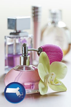 a perfume bottle, with atomizer, and an orchid flower - with Massachusetts icon