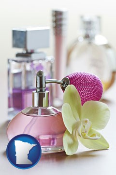 a perfume bottle, with atomizer, and an orchid flower - with Minnesota icon