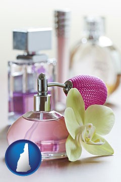 a perfume bottle, with atomizer, and an orchid flower - with New Hampshire icon