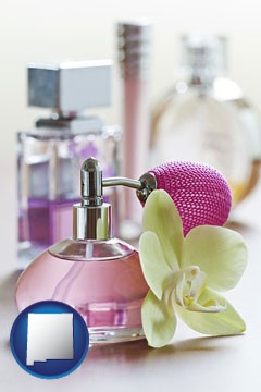 a perfume bottle, with atomizer, and an orchid flower - with New Mexico icon