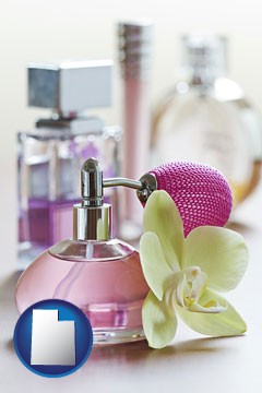 a perfume bottle, with atomizer, and an orchid flower - with Utah icon