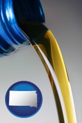 south-dakota map icon and motor oil being poured from a container