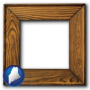 a wooden picture frame - with Maine icon