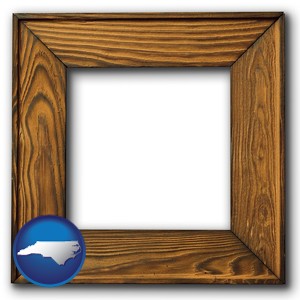 a wooden picture frame - with North Carolina icon