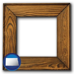 a wooden picture frame - with North Dakota icon