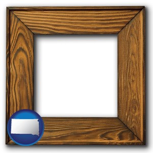 a wooden picture frame - with South Dakota icon