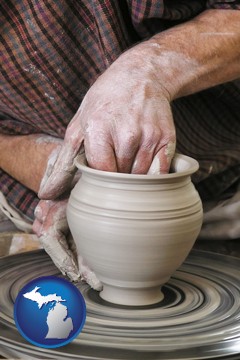 a potter making pottery on a pottery wheel - with Michigan icon