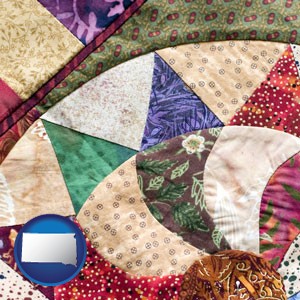a patchwork quilt - with South Dakota icon