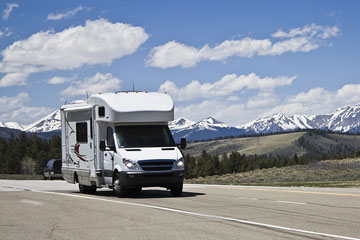 recreational vehicle and snow-capped mountains