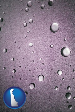 water droplets on a shower door - with Delaware icon