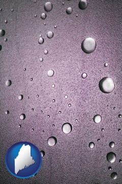 water droplets on a shower door - with Maine icon